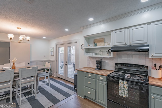 115 Lucian Cir, Savannah, GA 31406 - kitchen featuring under cabinet range hood, wood counters, black electric range oven, a textured ceiling, and french doors
