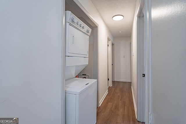 115 Lucian Cir, Savannah, GA 31406 - laundry room featuring stacked washer / drying machine, dark wood-type flooring, and baseboards