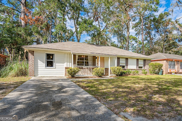 ranch-style house with a porch and a front lawn