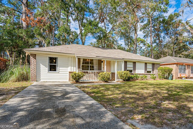 115 Lucian Cir, Savannah, GA 31406 - ranch-style house featuring a porch, brick siding, a shingled roof, and driveway