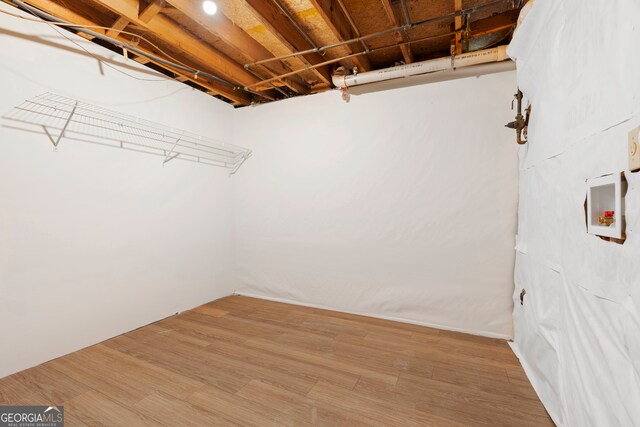 walk in closet featuring hardwood / wood-style flooring