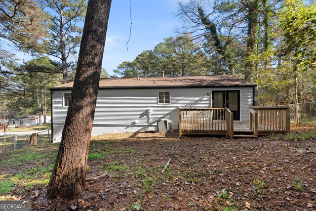 rear view of property with a deck