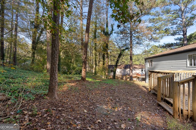 view of yard with a deck