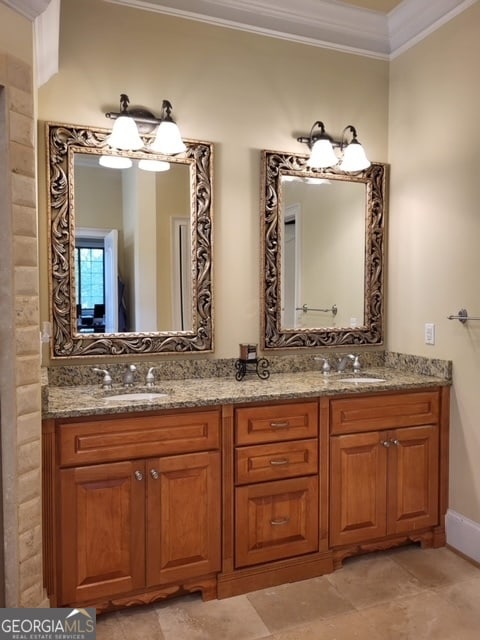 bathroom featuring vanity and ornamental molding