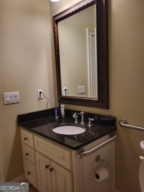 bathroom with vanity and toilet