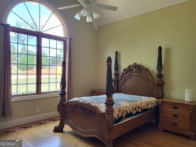 bedroom with ceiling fan and light hardwood / wood-style floors