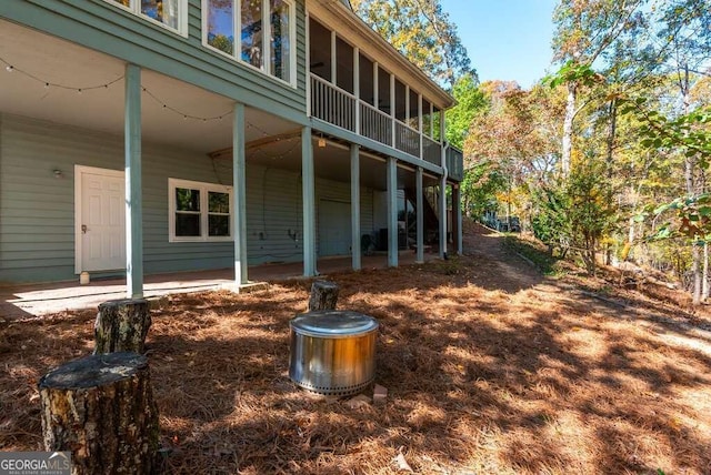 view of home's exterior with a sunroom