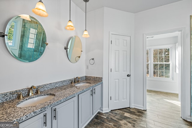 bathroom featuring hardwood / wood-style flooring and vanity