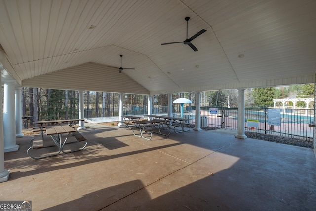 view of patio with ceiling fan, a community pool, and a playground