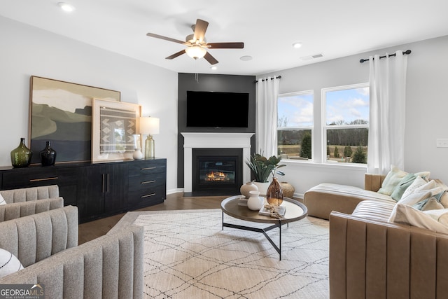 living room with hardwood / wood-style flooring and ceiling fan