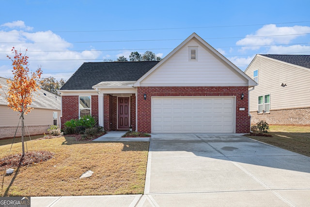 view of front of house featuring a front yard and a garage