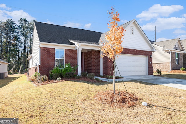 view of front of home with a garage and a front yard