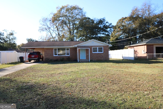 ranch-style house featuring a carport and a front lawn