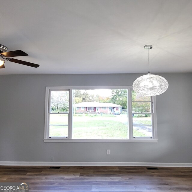 unfurnished room featuring ceiling fan and wood-type flooring