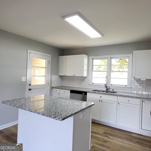 kitchen with white cabinets, stone counters, sink, and appliances with stainless steel finishes