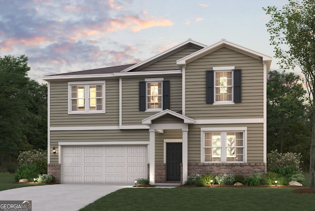 view of front of property featuring a yard and a garage