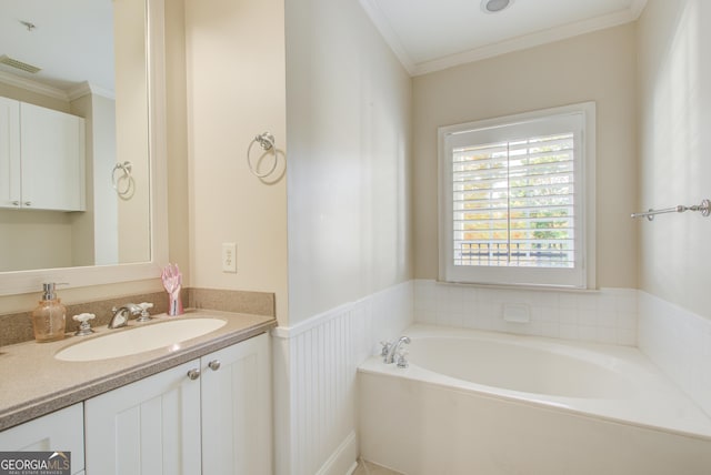 bathroom featuring a tub to relax in, crown molding, and vanity