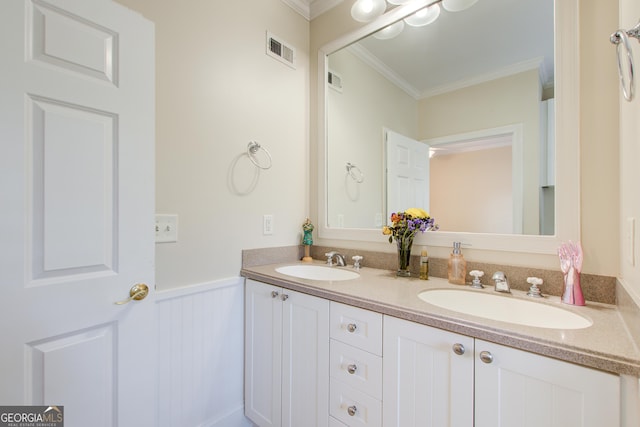 bathroom featuring vanity and ornamental molding