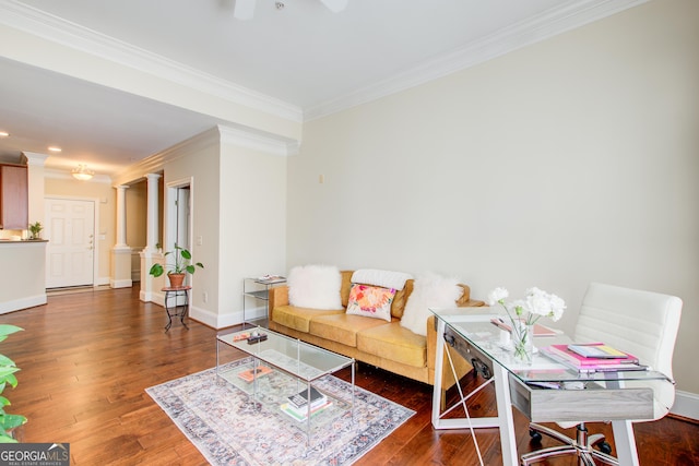 living room featuring ornate columns, crown molding, dark hardwood / wood-style flooring, and ceiling fan