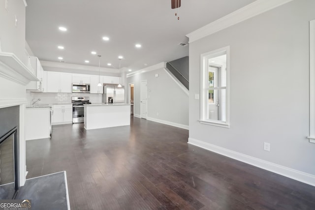 3102-B Brownstone Ln SE, Atlanta, GA 30354 - unfurnished living room featuring dark wood-type flooring, ceiling fan, ornamental molding, and sink