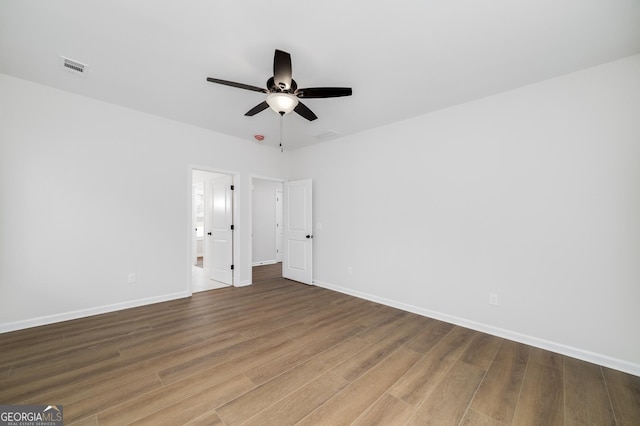 spare room featuring ceiling fan and hardwood / wood-style flooring