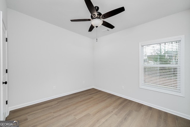 unfurnished room featuring light hardwood / wood-style floors and ceiling fan