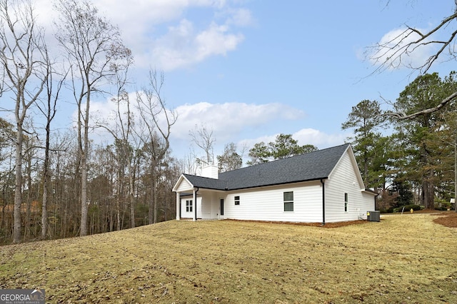 rear view of house with cooling unit