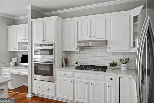 kitchen with tasteful backsplash, dark wood-type flooring, white cabinets, and stainless steel appliances