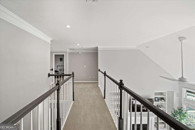 hallway with light carpet, vaulted ceiling, and crown molding