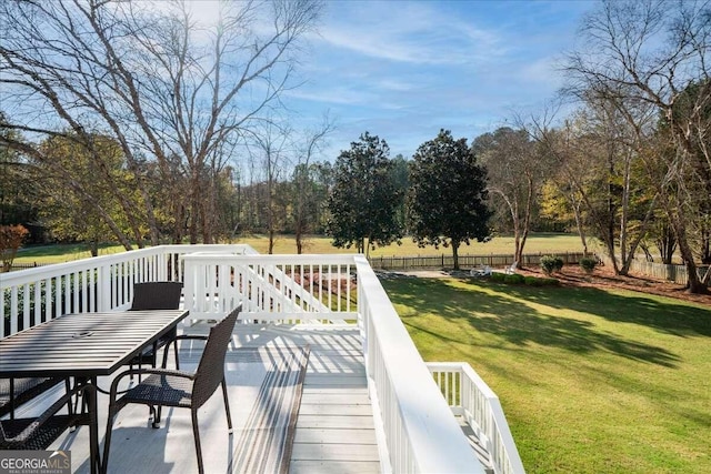 wooden terrace with a yard