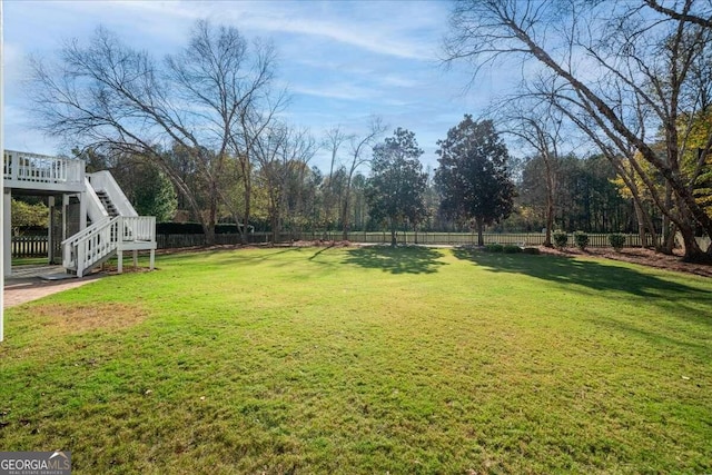 view of yard featuring a wooden deck