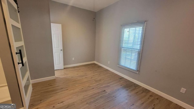 unfurnished bedroom with light wood-type flooring