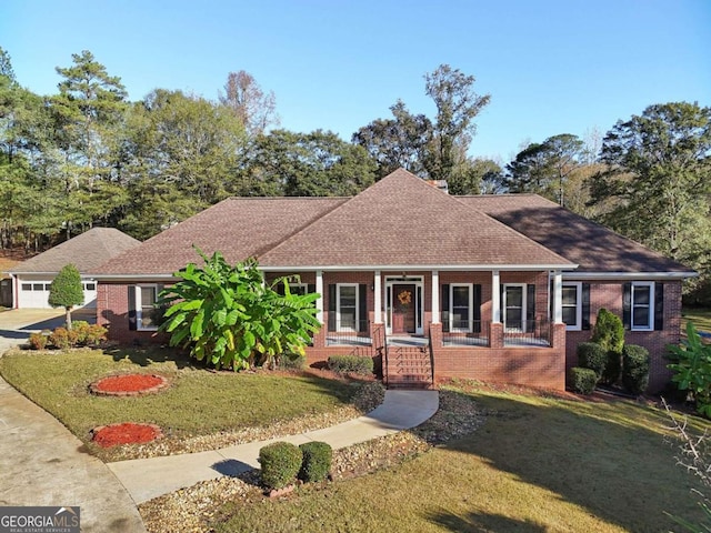 view of front of house featuring covered porch and a front yard