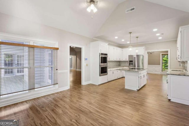 unfurnished sunroom featuring ceiling fan and vaulted ceiling