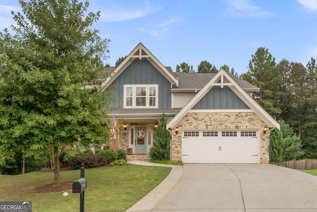 craftsman inspired home with a garage and a front lawn