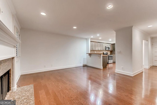 unfurnished living room with dark hardwood / wood-style flooring