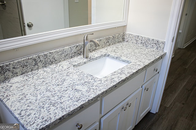 bathroom featuring hardwood / wood-style floors and vanity