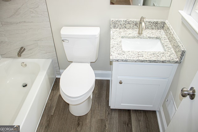 full bathroom with vanity, wood-type flooring, and toilet