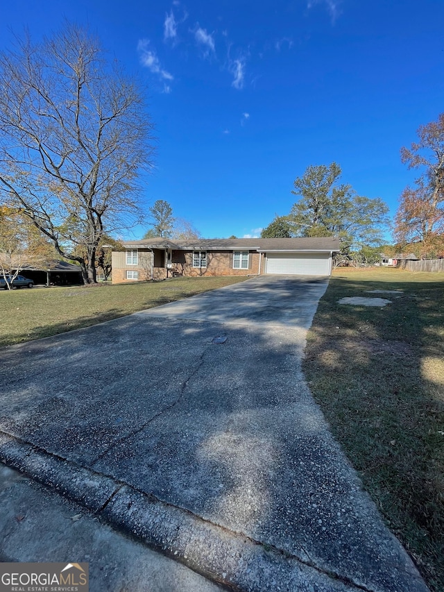 single story home with a front lawn and a garage