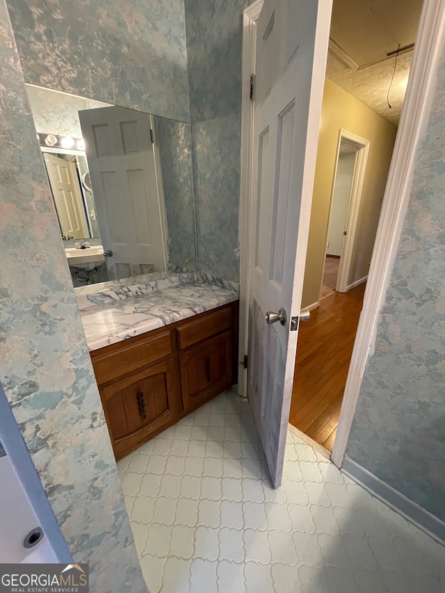 bathroom featuring hardwood / wood-style floors and vanity