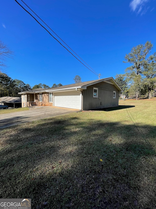 view of home's exterior with a yard and a garage