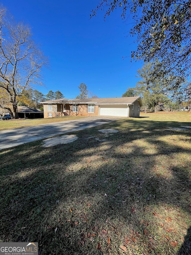 view of front of house with a front yard and a garage