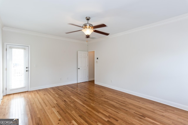 spare room with light hardwood / wood-style flooring, ornamental molding, and ceiling fan