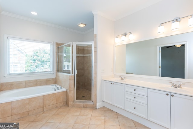 bathroom with tile patterned flooring, ornamental molding, independent shower and bath, and vanity