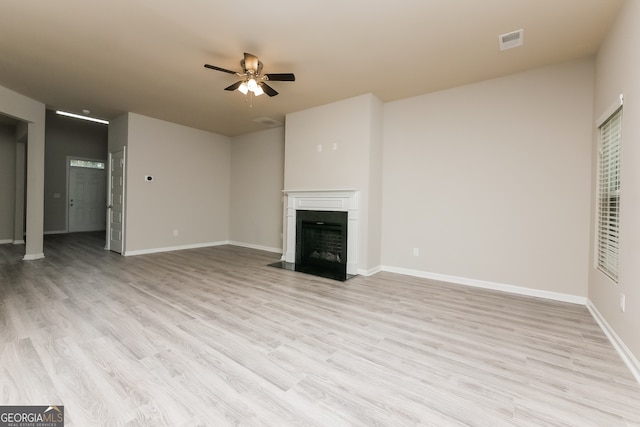 unfurnished living room featuring light hardwood / wood-style floors and ceiling fan