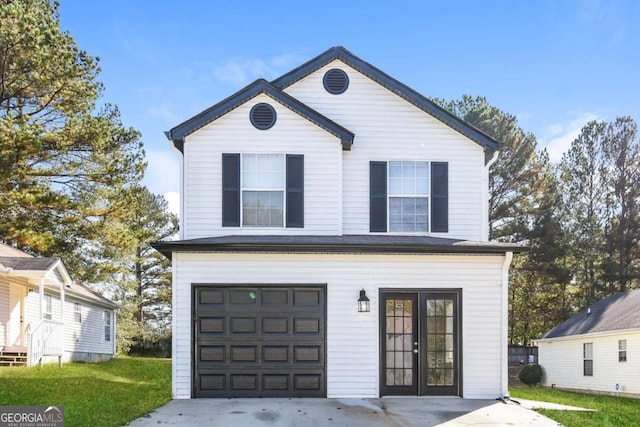 view of property featuring french doors, a garage, and a front lawn