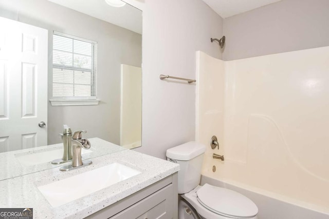 full bathroom with bathtub / shower combination, vanity, and toilet