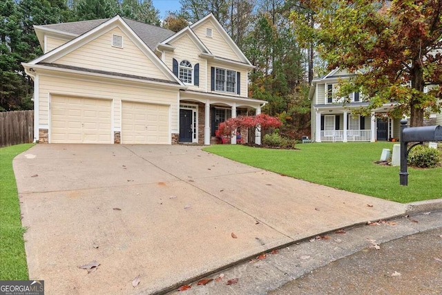 view of front of home with a porch and a front yard