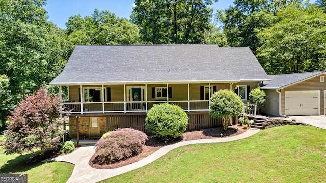 view of front of house with a front lawn and a garage