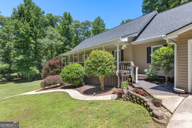 exterior space featuring a porch and a front yard